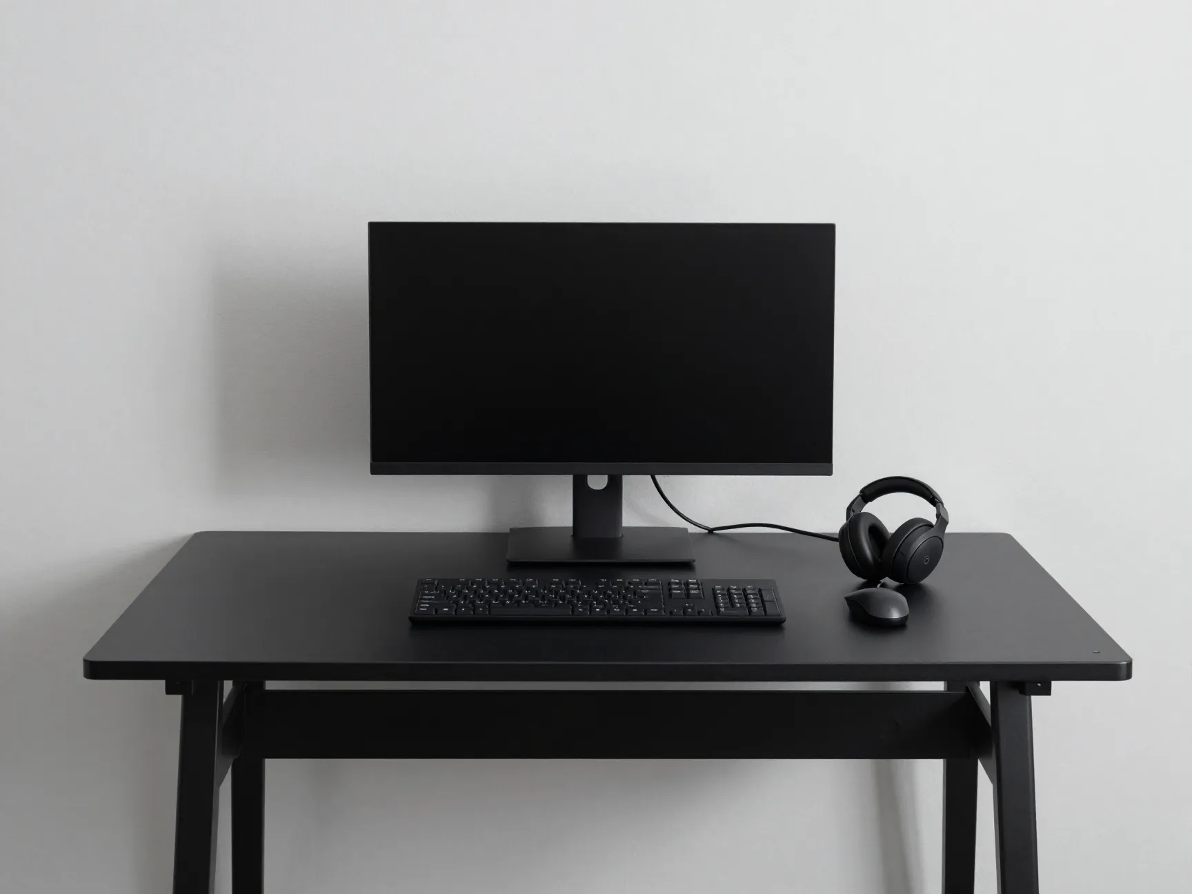 Minimal all black desk setup