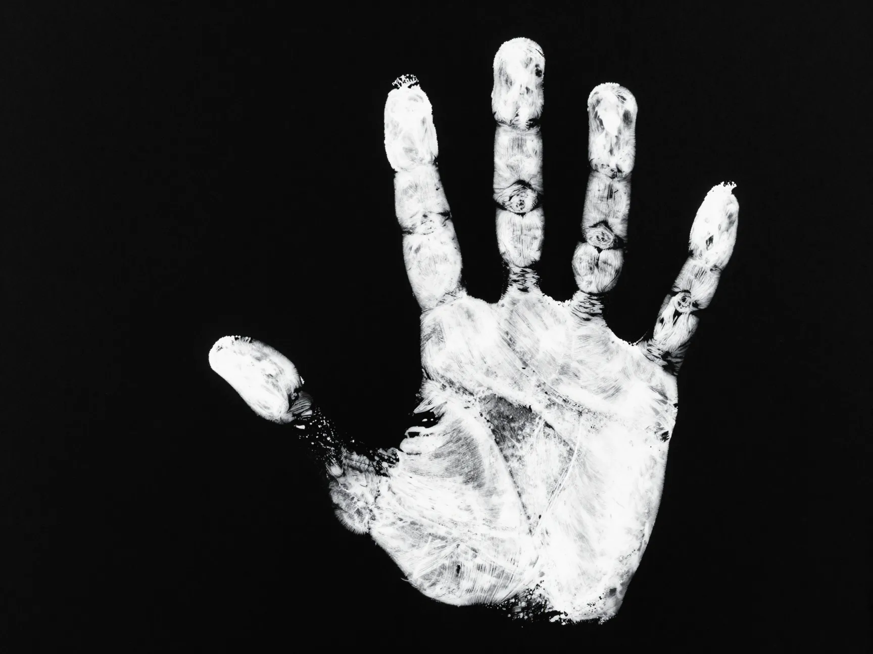 The bold handprint on black