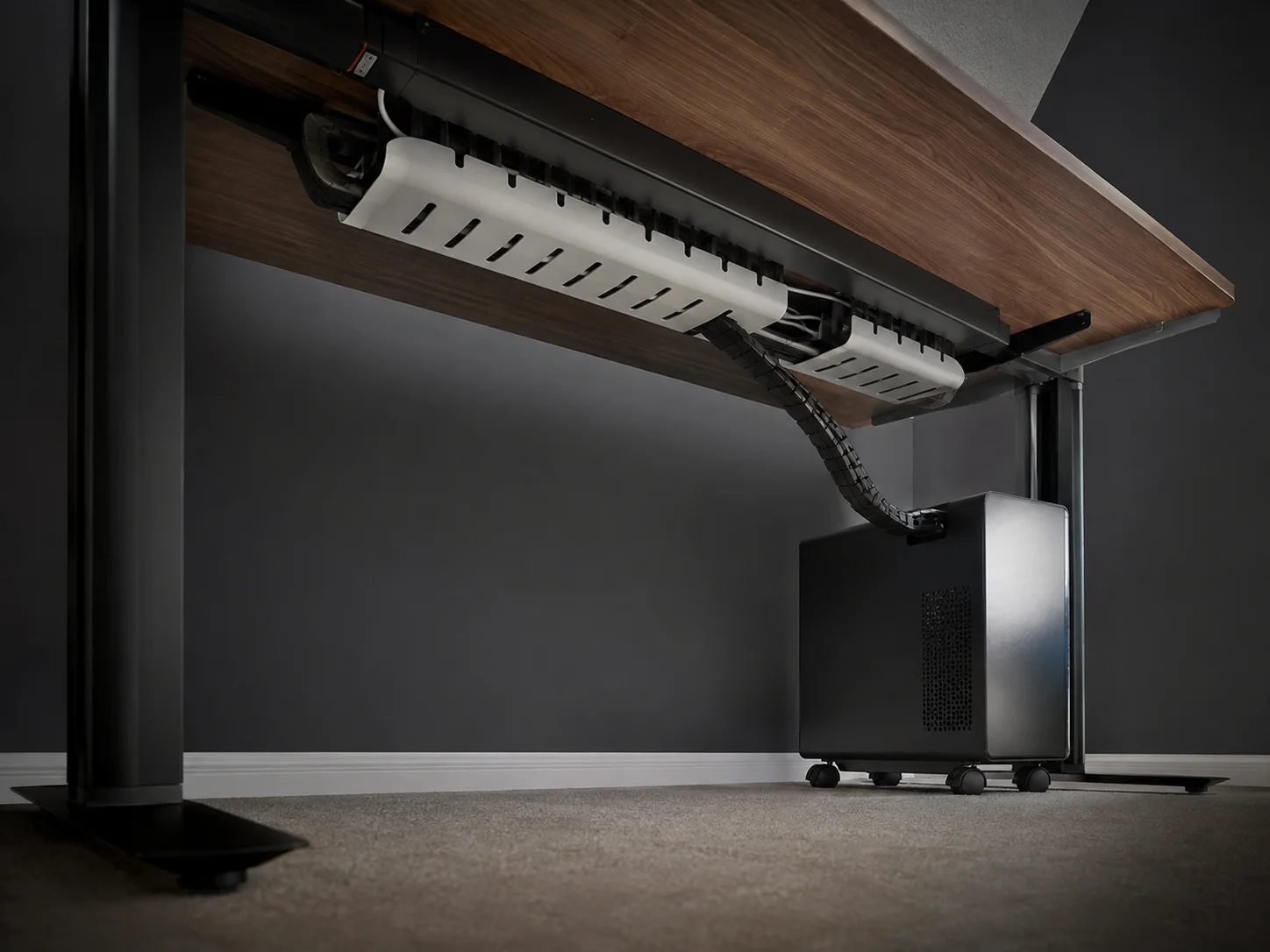 Route and hide every remaining cable under the desk
