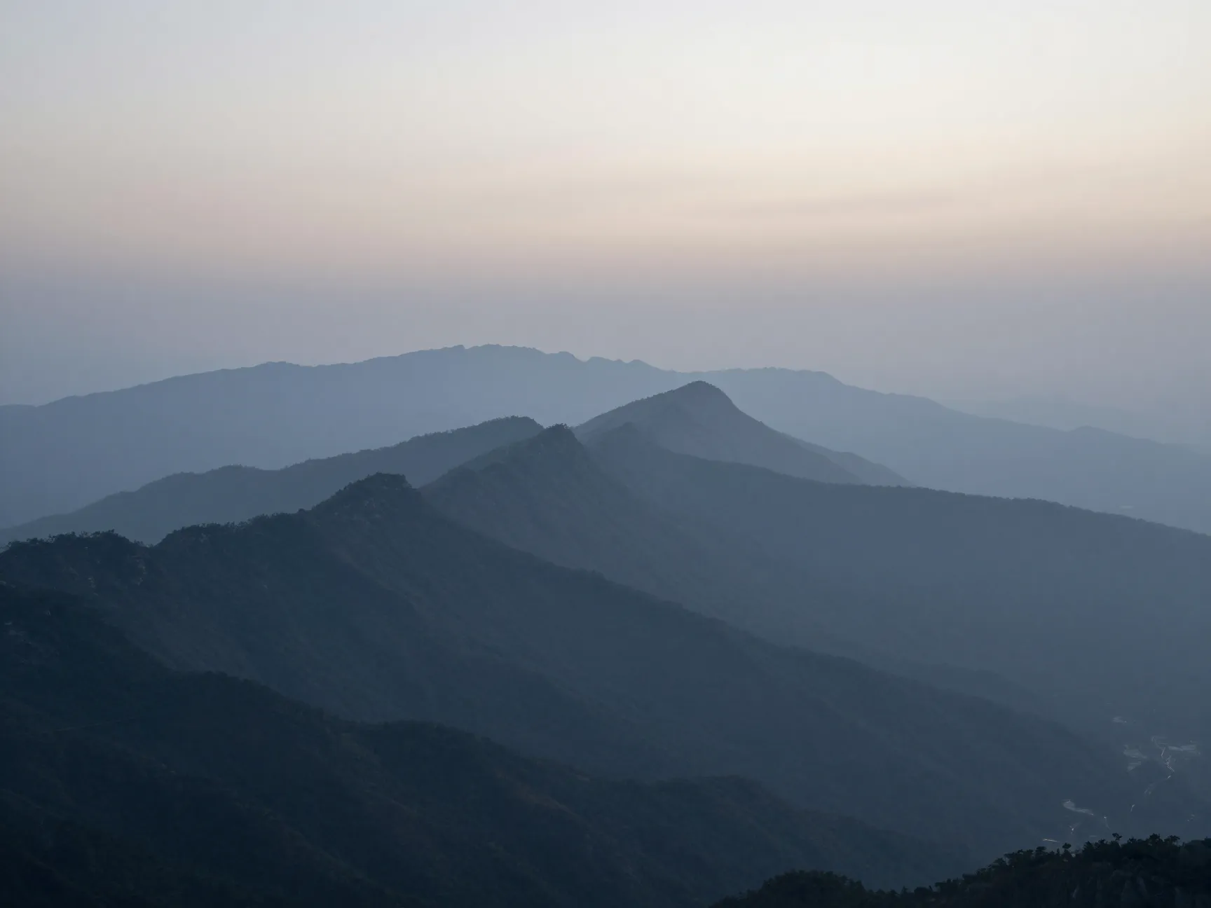 Misty mountain ridges at first light