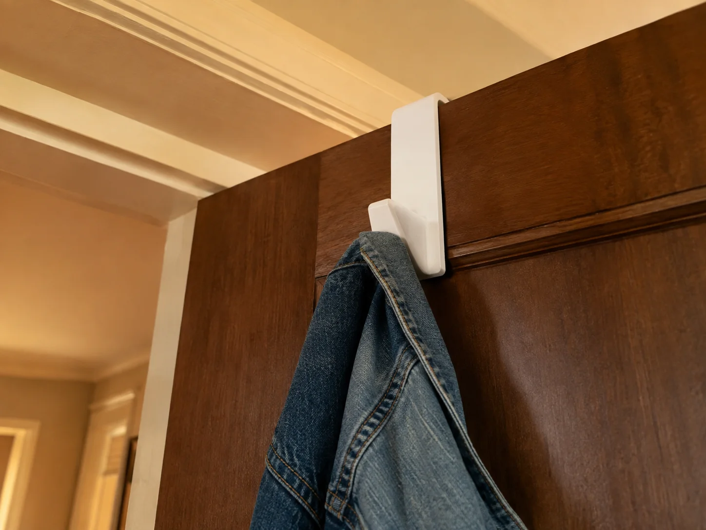Install an over door hook for clothes and bags